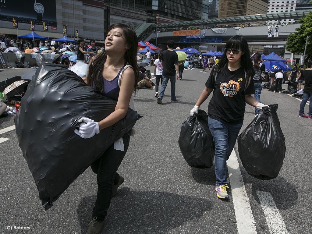 protesters collect garbage
